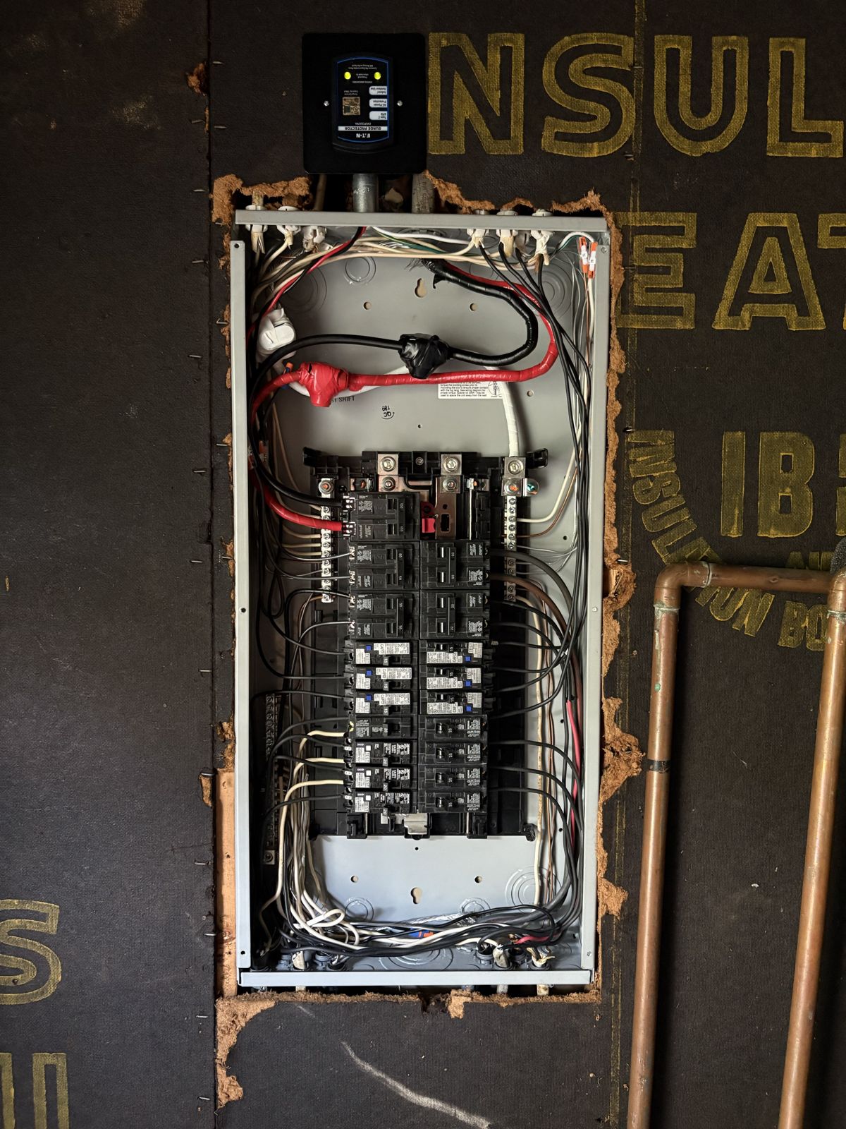 New Eaton BR panel with AFCI breakers and a whole-house surge protector mounted above it