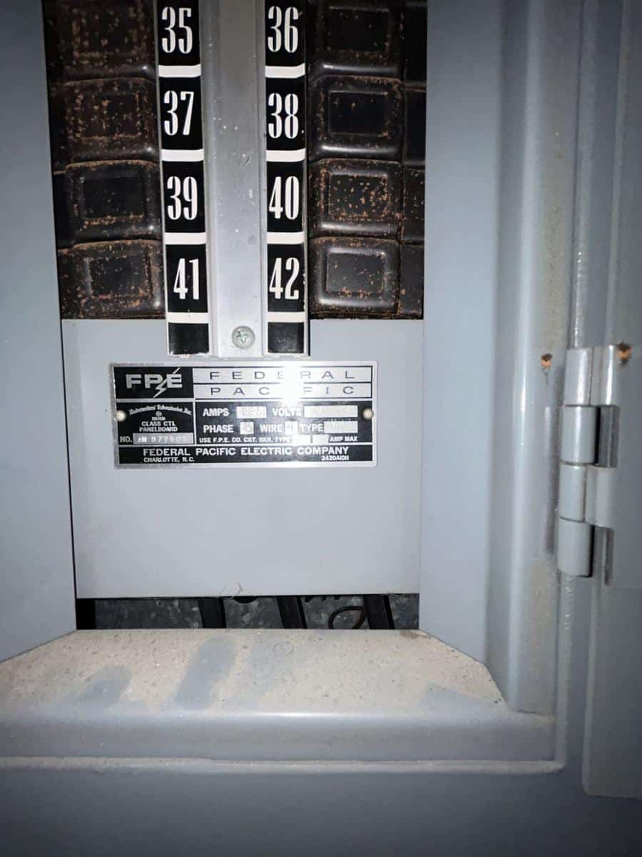 Federal Pacific Electric Stab-Lok panel label and breakers before replacement