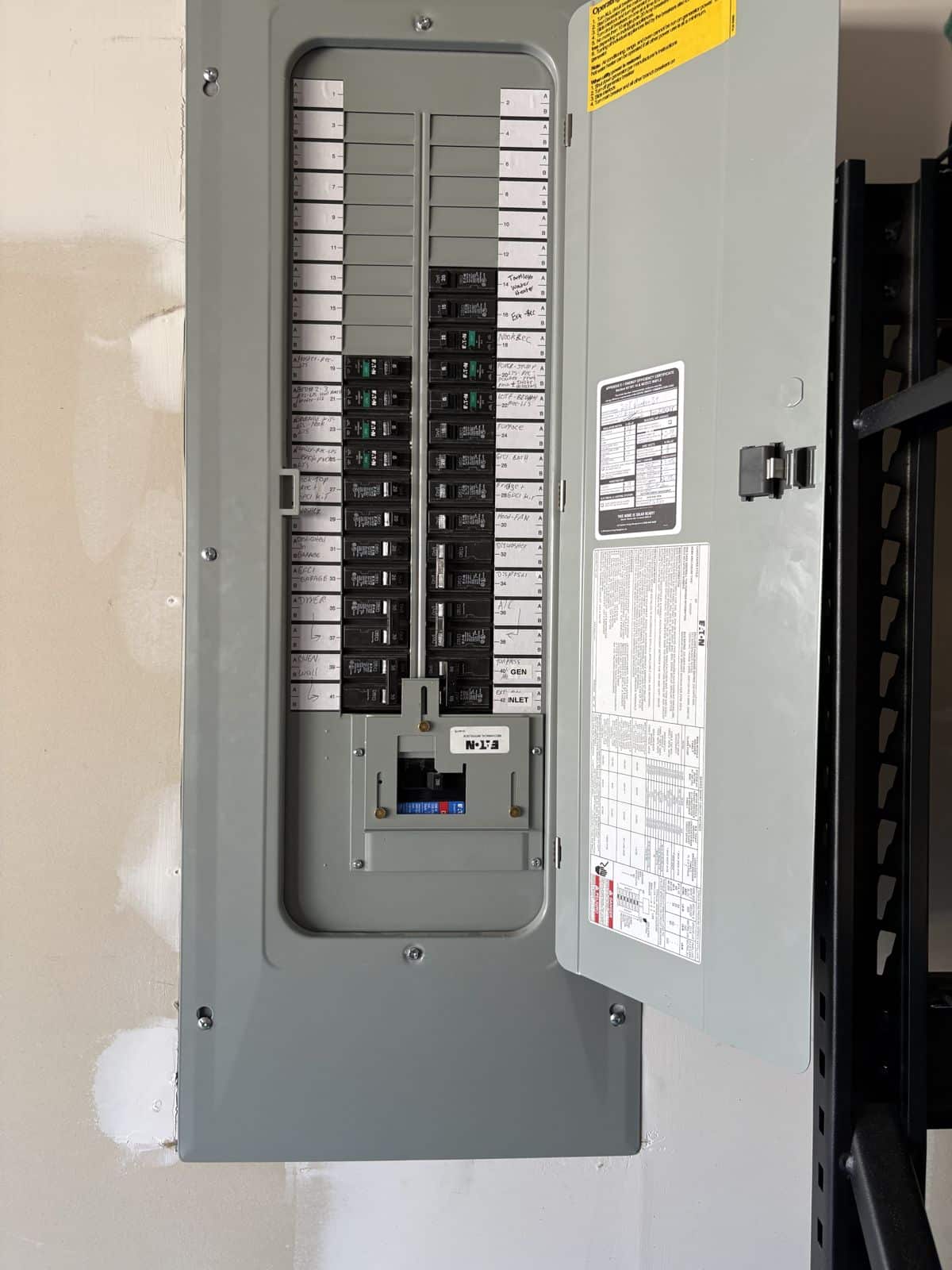 Generator interlock kit installed on an Eaton panel cover