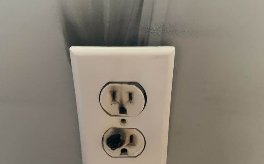 Scorched wall outlet from an overheated connection — an ARC Electric emergency call