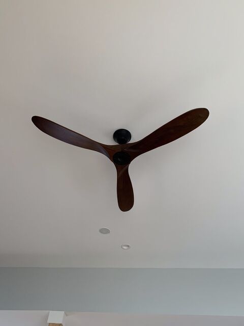 Three-blade ceiling fan on a vaulted ceiling
