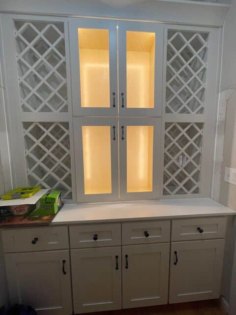 In-cabinet LED lighting behind lattice cabinet doors