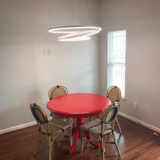 Double-ring LED pendant over a breakfast table