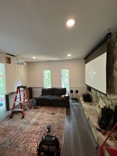 Recessed lighting in a media room with a projector screen