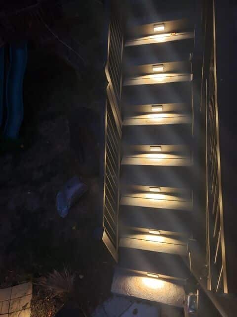 Outdoor stair lights lighting each tread at night
