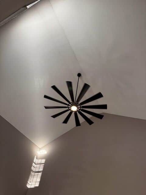 Windmill-style ceiling fan on a cathedral ceiling